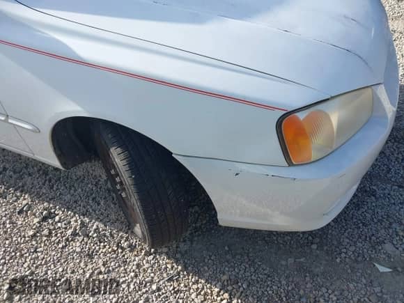 2002 Hyundai Accent GL z VIN KMHCG45C92U347708, wystawiony jako IAAI lot #42137086 z przebiegiem 73 271 mil mil oraz . Historia ofert i sprzedaży dostępna na DreamBid. Obrazek 12.