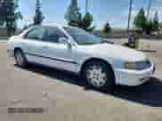 1997 Honda Accord LX with VIN 1HGCD5634VA244155, listed as a Copart auction lot 70736475 with 239,580 mi miles and Salvage title. Bid and sale history available at DreamBid. Image 4.