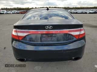 2013 Hyundai Azera с VIN KMHFH4JG3DA221836, выставлен на аукционе Copart как лот 83226124 с пробегом 178 484 миль миль и Списание • Salvage title. История ставок и продаж доступна на DreamBid. Изображение 6.