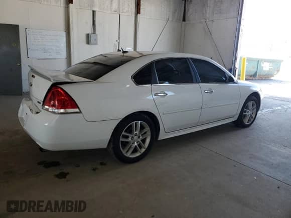 2012 Chevrolet Impala LTZ with VIN 2G1WC5E32C1320441, listed as a Copart auction lot 71558515 with 200,170 mi miles and Salvage title. Bid and sale history available at DreamBid. Image 3.
