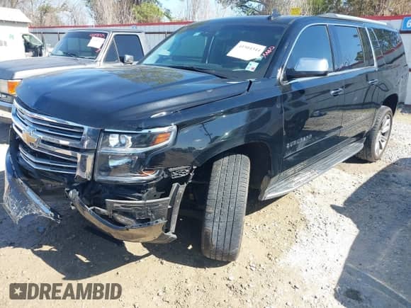 2019 Chevrolet Suburban Premier with VIN 1GNSCJKC5KR360318, listed as a IAAI auction lot 41504344 with 82,997 mi miles and . Bid and sale history available at DreamBid. Image 2.