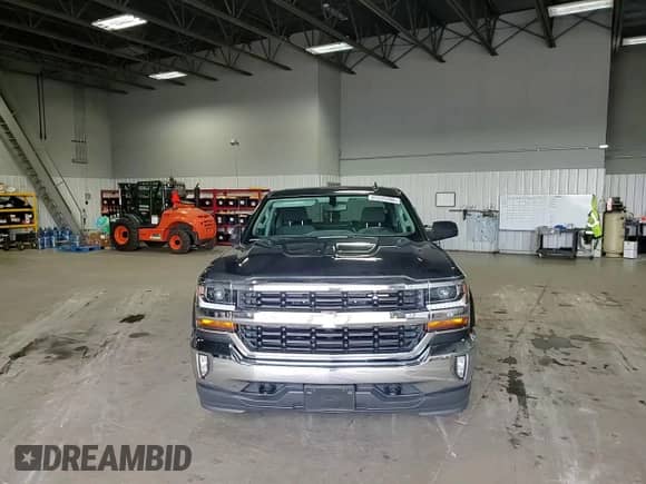 2018 Chevrolet Silverado 1500 LT z VIN 3GCUKREC5JG317420, wystawiony jako Copart lot #65535305 z przebiegiem 43 632 mil mil oraz Szkoda całkowita • Salvage title. Historia ofert i sprzedaży dostępna na DreamBid. Obrazek 13.