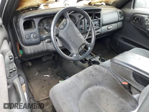 1998 Dodge Dakota SLT z VIN 1B7GG22Y0WS663798, wystawiony jako Copart lot #44569915 z przebiegiem Nie podano mil oraz Szkoda całkowita • Salvage title. Historia ofert i sprzedaży dostępna na DreamBid. Obrazek 8.