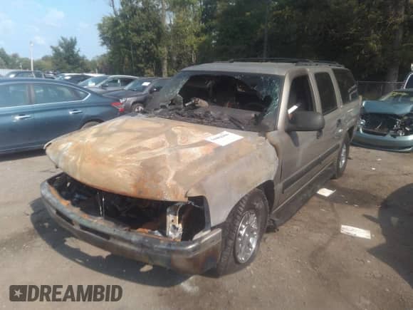 2003 Chevrolet Suburban LT z VIN 1GNEC16Z43J254339, wystawiony jako IAAI lot #39240820 z przebiegiem 180 945 mil mil oraz . Historia ofert i sprzedaży dostępna na DreamBid. Obrazek 6.