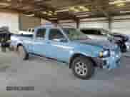 2003 Nissan Frontier XE with VIN 1N6ED29X63C443596, listed as a Copart auction lot 69464285 with 262,770 mi miles and Salvage title. Bid and sale history available at DreamBid. Image 4.