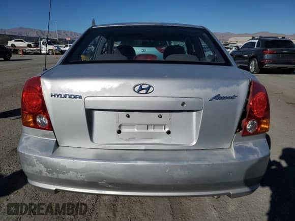 2003 Hyundai Accent GL с VIN KMHCG45C63U413388, выставлен на аукционе Copart как лот 88979235 с пробегом 240 928 миль миль и Списание • Salvage title. История ставок и продаж доступна на DreamBid. Изображение 6.