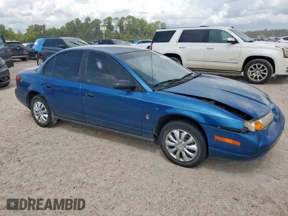 2002 Saturn SL with VIN 1G8ZF52812Z229544, listed as a Copart auction lot 83826835 with 214,162 mi miles and Salvage title. Bid and sale history available at DreamBid. Image 4.