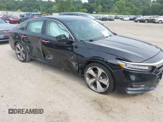 2018 Honda Accord Touring with VIN 1HGCV2F9XJA033990, listed as a IAAI auction lot 42901257 with 110,822 mi miles and . Bid and sale history available at DreamBid. Image 1.