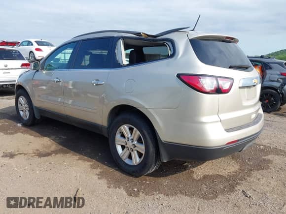 2014 Chevrolet Traverse LT z VIN 1GNKRHKD7EJ169048, wystawiony jako IAAI lot #42332958 z przebiegiem 184 819 mil mil oraz . Historia ofert i sprzedaży dostępna na DreamBid. Obrazek 3.