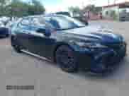 2023 Toyota Camry TRD with VIN 4T1KZ1AK7PU072266, listed as a IAAI auction lot 43208479 with 58,999 mi miles and . Bid and sale history available at DreamBid. Image 1.