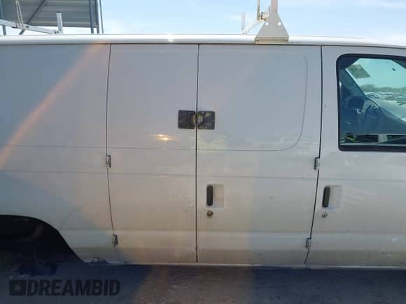 2004 Ford Econoline Cargo with VIN 1FTRE14W44HA29084, listed as a IAAI auction lot 41793350 with 123,429 mi miles and . Bid and sale history available at DreamBid. Image 13.
