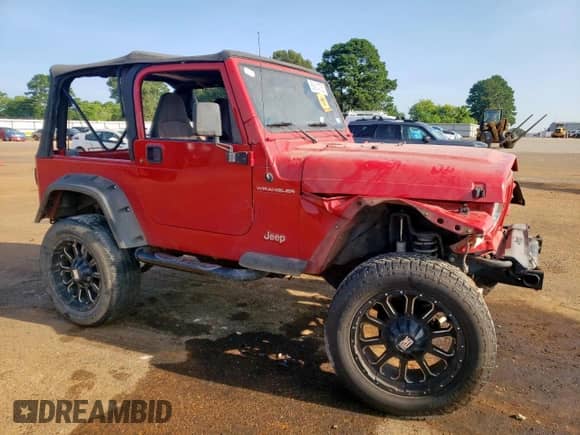 2000 Jeep Wrangler SE with VIN 1J4FA29P6YP703375, listed as a Copart auction lot 66914735 with 174,624 mi miles and Salvage title. Bid and sale history available at DreamBid. Image 4.