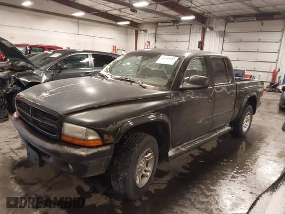 2003 Dodge Dakota Sport with VIN 1D7HG38N83S115959, listed as a IAAI auction lot 41594423 with 234,411 mi miles and . Bid and sale history available at DreamBid. Image 2.