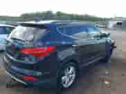 2014 Hyundai Santa Fe z VIN 5XYZUDLA7EG156349, wystawiony jako IAAI lot #43368098 z przebiegiem 128 126 mil mil oraz . Historia ofert i sprzedaży dostępna na DreamBid. Obrazek 4.