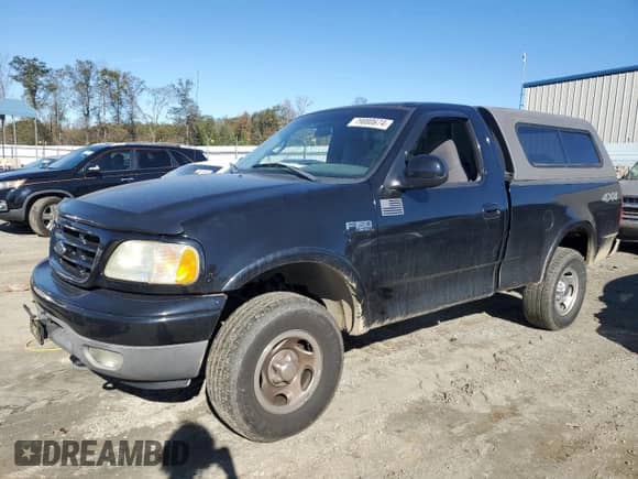 2002 Ford F-150 XL z VIN 1FTRF18232NA58109, wystawiony jako Copart lot #79080674 z przebiegiem 148 213 mil mil oraz Szkoda całkowita • Salvage title. Historia ofert i sprzedaży dostępna na DreamBid. Obrazek 1.