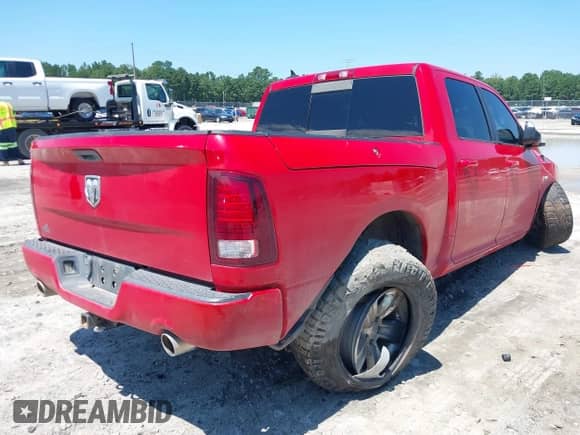 2014 Ram 1500 Sport with VIN 1C6RR6MT2ES153499, listed as a IAAI auction lot 43006411 with 126,842 mi miles and . Bid and sale history available at DreamBid. Image 4.