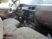 2001 Toyota Tacoma with VIN 5TEPM62NX1Z782677, listed as a Copart auction lot 87704115 with 317,487 mi miles and Salvage title. Bid and sale history available at DreamBid. Image 8.