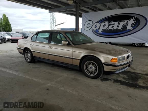 1998 BMW 7 Series 740iL with VIN WBAGJ832XWDM11394, listed as a Copart auction lot 54390685 with 126,828 mi miles and Clean title. Bid and sale history available at DreamBid. Image 4.