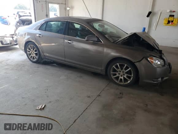 2010 Chevrolet Malibu LTZ with VIN 1G1ZE5EB9A4119121, listed as a Copart auction lot 68419385 with 190,784 mi miles and Salvage title. Bid and sale history available at DreamBid. Image 4.