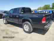 2001 Dodge Dakota Sport with VIN 1B7GG2AN81S113605, listed as a Copart auction lot 58990065 with 243,919 mi miles and Clean title. Bid and sale history available at DreamBid. Image 2.