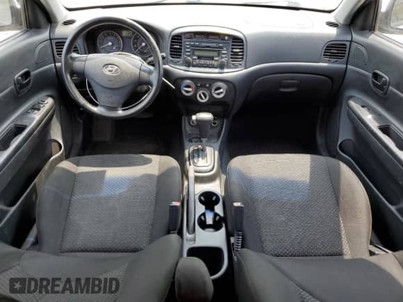 2007 Hyundai Accent SE z VIN KMHCN36CX7U038061, wystawiony jako Copart lot #63790134 z przebiegiem 104 618 mil mil oraz Szkoda całkowita • Salvage title. Historia ofert i sprzedaży dostępna na DreamBid. Obrazek 8.