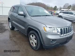 2012 Jeep Grand Cherokee Laredo z VIN 1C4RJFAGXCC118823, wystawiony jako IAAI lot #41808398 z przebiegiem 153 509 mil mil oraz . Historia ofert i sprzedaży dostępna na DreamBid. Obrazek 1.