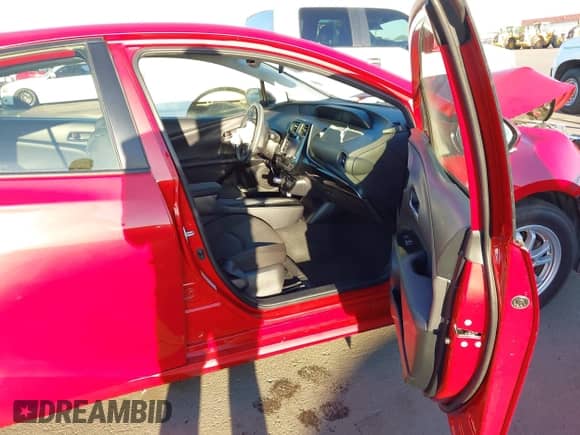 2021 Toyota Prius L Eco with VIN JTDKAMFU6M3152201, listed as a IAAI auction lot 43278670 with 144,414 mi miles and . Bid and sale history available at DreamBid. Image 5.