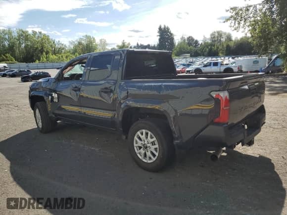 2024 Toyota Tacoma SR with VIN 3TYKD5HN0RT013601, listed as a Copart auction lot 69126575 with 4,033 mi miles and Salvage title. Bid and sale history available at DreamBid. Image 2.