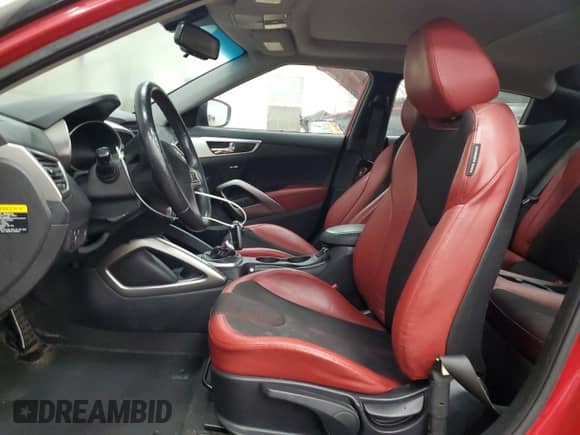 2012 Hyundai Veloster w/Black Int z VIN KMHTC6AD3CU049324, wystawiony jako Copart lot #85596195 z przebiegiem 171 178 mil mil oraz Szkoda całkowita • Salvage title. Historia ofert i sprzedaży dostępna na DreamBid. Obrazek 7.