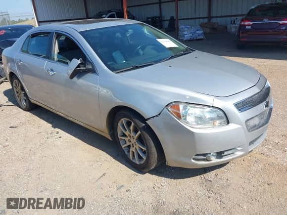 2012 Chevrolet Malibu LTZ z VIN 1G1ZG5E7XCF271129, wystawiony jako IAAI lot #42713063 z przebiegiem 127 511 mil mil oraz . Historia ofert i sprzedaży dostępna na DreamBid. Obrazek 1.