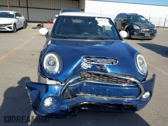 2017 MINI Hardtop Cooper S z VIN WMWXP7C58H3B93583, wystawiony jako IAAI lot #42697410 z przebiegiem 75 687 mil mil oraz . Historia ofert i sprzedaży dostępna na DreamBid. Obrazek 13.