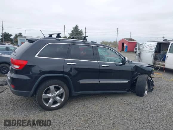 2013 Jeep Grand Cherokee Limited z VIN 1C4RJFBT4DC503856, wystawiony jako IAAI lot #43166356 z przebiegiem 143 262 mil mil oraz . Historia ofert i sprzedaży dostępna na DreamBid. Obrazek 13.