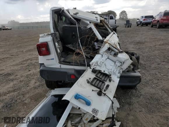 2021 Jeep Wrangler Unlimited Sahara with VIN 1C4JJXP64MW682744, listed as a Copart auction lot 69235075 with 65,533 mi miles and Salvage title. Bid and sale history available at DreamBid. Image 6.
