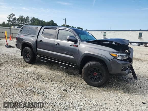 2023 Toyota Tacoma SR с VIN 3TMCZ5AN1PM558196, выставлен на аукционе Copart как лот 70459135 с пробегом 20 863 миль миль и Списание • Salvage title. История ставок и продаж доступна на DreamBid. Изображение 4.