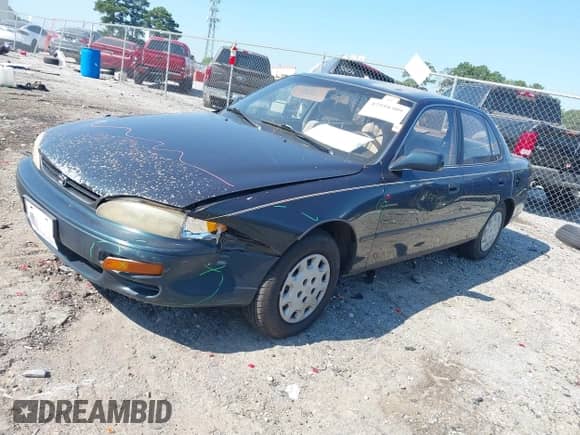 1995 Toyota Camry LE z VIN 4T1SK12E9SU631807, wystawiony jako IAAI lot #42958309 z przebiegiem 198 951 mil mil oraz . Historia ofert i sprzedaży dostępna na DreamBid. Obrazek 2.
