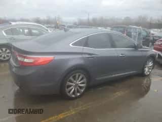 2013 Hyundai Azera z VIN KMHFH4JG0DA323501, wystawiony jako Copart lot #84069634 z przebiegiem 96 296 mil mil oraz Szkoda całkowita • Salvage title. Historia ofert i sprzedaży dostępna na DreamBid. Obrazek 3.