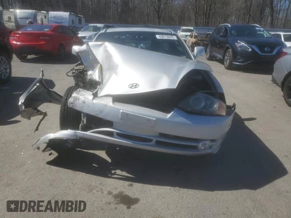 2003 Hyundai Tiburon с VIN KMHHM65D03U056017, выставлен на аукционе Copart как лот 49678695 с пробегом 99 729 миль миль и Списание • Salvage title. История ставок и продаж доступна на DreamBid. Изображение 5.