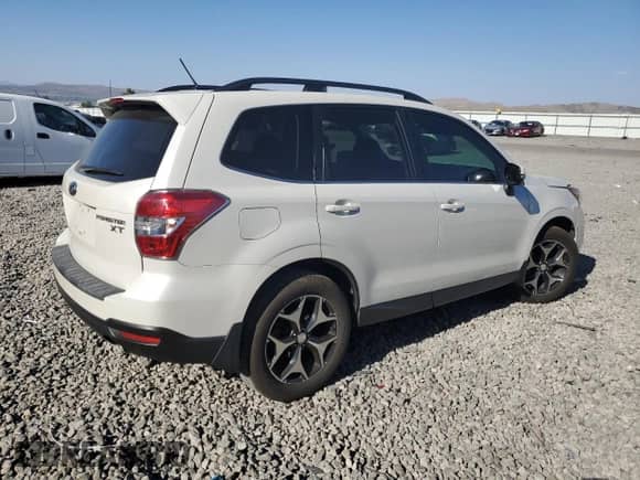 2014 Subaru Forester XT Touring with VIN JF2SJGMC0EH421231, listed as a Copart auction lot 65372135 with 117,057 mi miles and Salvage title. Bid and sale history available at DreamBid. Image 3.