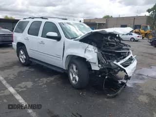 2013 Chevrolet Tahoe LTZ with VIN 1GNSKCE07DR123820, listed as a IAAI auction lot 43353310 with 105,053 mi miles and . Bid and sale history available at DreamBid. Image 1.