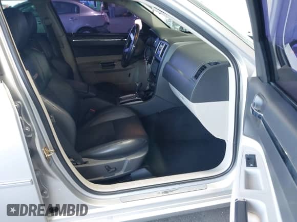 2006 Chrysler 300 C SRT-8 with VIN 2C3LA73W26H471000, listed as a IAAI auction lot 42884335 with 148,180 mi miles and . Bid and sale history available at DreamBid. Image 5.