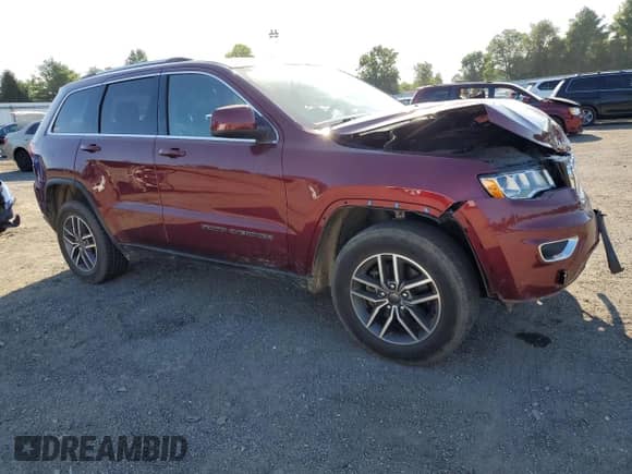 2020 Jeep Grand Cherokee Laredo E with VIN 1C4RJFAG7LC398457, listed as a Copart auction lot 70829065 with 52,734 mi miles and Salvage title. Bid and sale history available at DreamBid. Image 4.