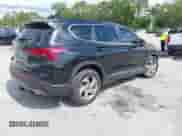 2021 Hyundai Santa Fe SE with VIN 5NMS14AJ0MH332918, listed as a IAAI auction lot 42365534 with 58,720 mi miles and . Bid and sale history available at DreamBid. Image 4.