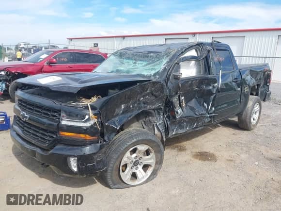 2018 Chevrolet Silverado 1500 LT with VIN 3GCUKREC9JG562169, listed as a IAAI auction lot 43220961 with 143,086 mi miles and . Bid and sale history available at DreamBid. Image 2.