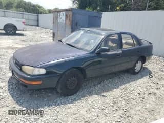 1994 Toyota Camry LE z VIN 4T1SK12E3RU427143, wystawiony jako Copart lot #67064105 z przebiegiem 324 498 mil mil oraz Czysty tytuł • Clean title. Historia ofert i sprzedaży dostępna na DreamBid. Obrazek 1.