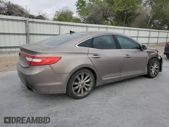 2013 Hyundai Azera с VIN KMHFH4JG6DA231521, выставлен на аукционе Copart как лот 50327805 с пробегом 176 041 миль миль и Списание • Salvage title. История ставок и продаж доступна на DreamBid. Изображение 3.