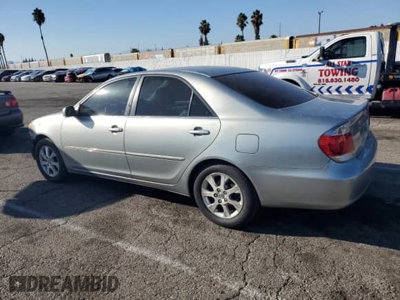 2005 Toyota Camry LE с VIN JTDBF30KX50160730, выставлен на аукционе Copart как лот 84997435 с пробегом 238 964 миль миль и Списание • Salvage title. История ставок и продаж доступна на DreamBid. Изображение 2.