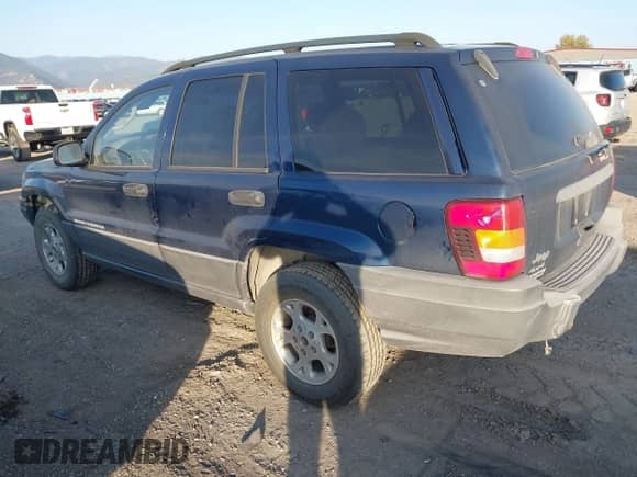2002 Jeep Grand Cherokee Sport with VIN 1J4GW38S32C181840, listed as a IAAI auction lot 43237876 with 157,878 mi miles and . Bid and sale history available at DreamBid. Image 3.