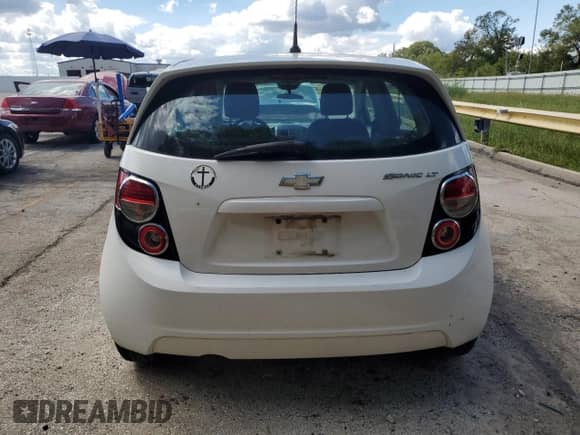 2013 Chevrolet Sonic LT with VIN 1G1JC6SG9D4206806, listed as a Copart auction lot 83852955 with 144,636 mi miles and Salvage title. Bid and sale history available at DreamBid. Image 6.