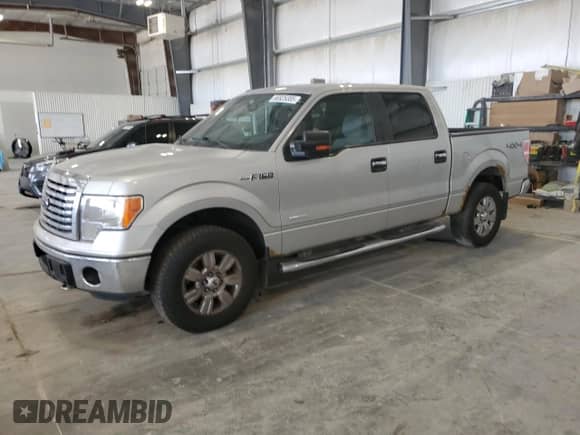 2012 Ford F-150 Lariat with VIN 1FTFW1ET4CFC79536, listed as a Copart auction lot 66925385 with 147,177 mi miles and Salvage title. Bid and sale history available at DreamBid. Image 1.