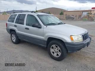 2003 Jeep Grand Cherokee Laredo with VIN 1J4GW48S03C512445, listed as a IAAI auction lot 43328127 with 294,831 mi miles and . Bid and sale history available at DreamBid. Image 1.